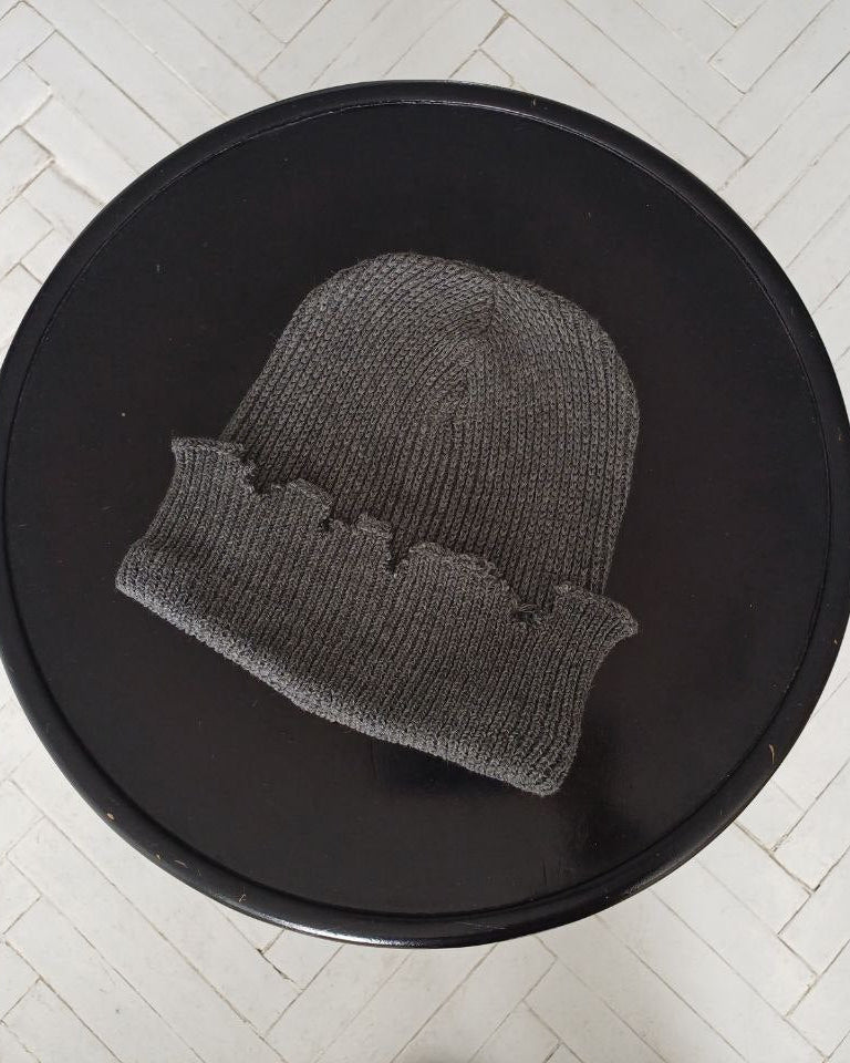 The raps cap is torn, light gray