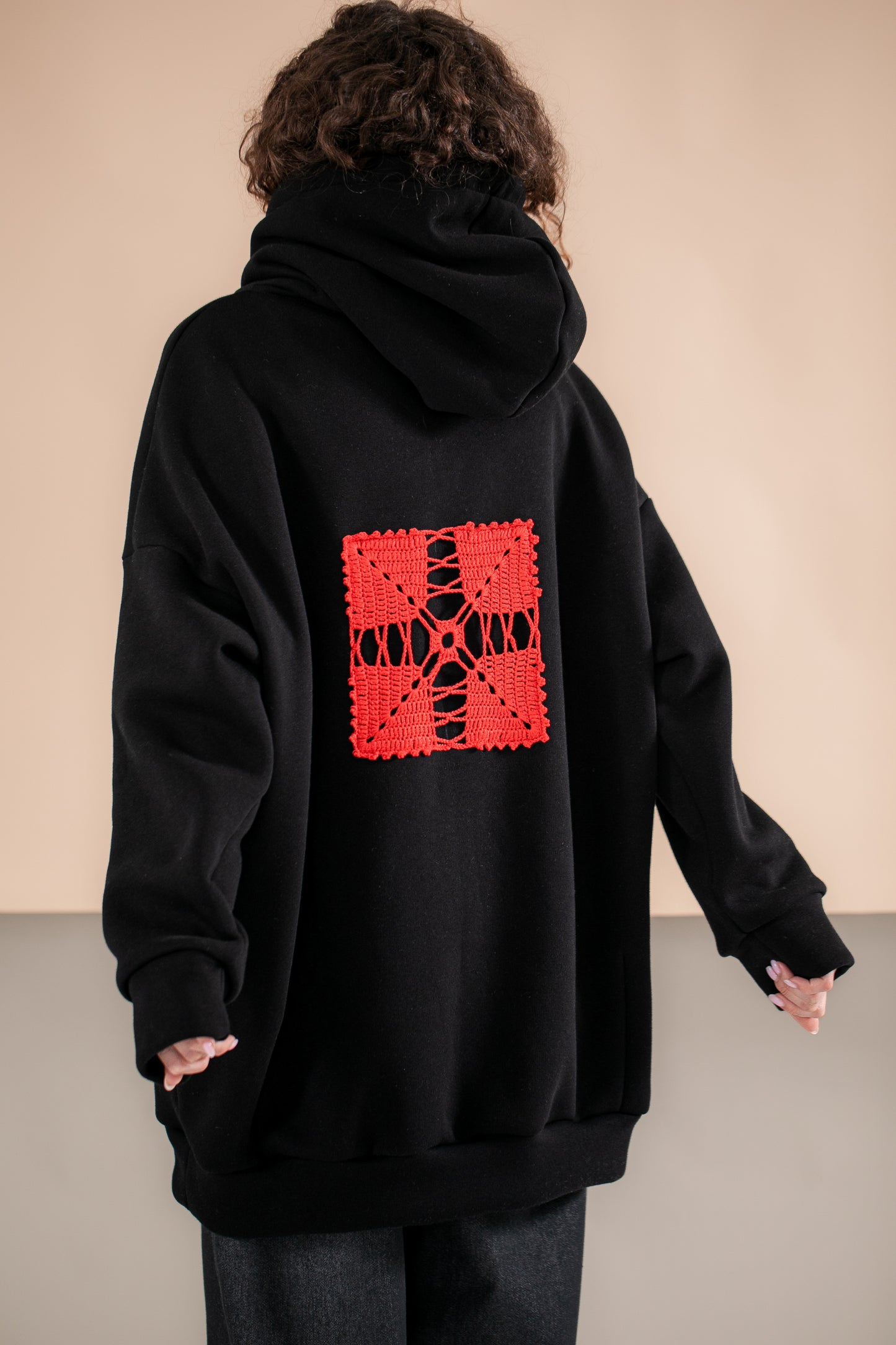 Black oversize hoodie with ethnic decoration