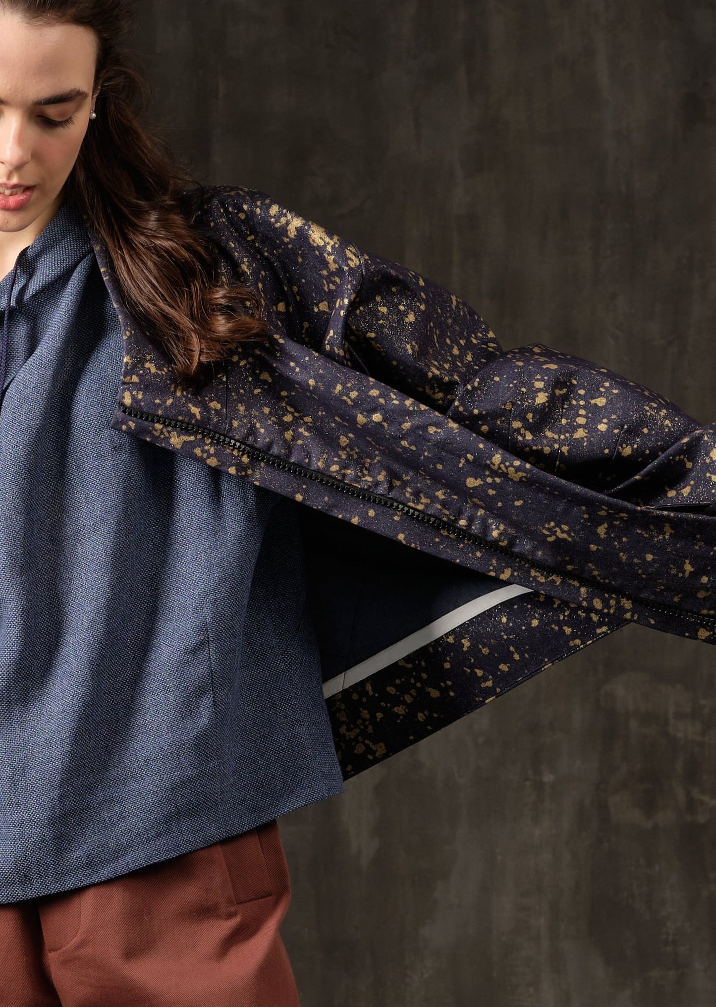 Denim bomber jacket in ink with gold detailing on the back