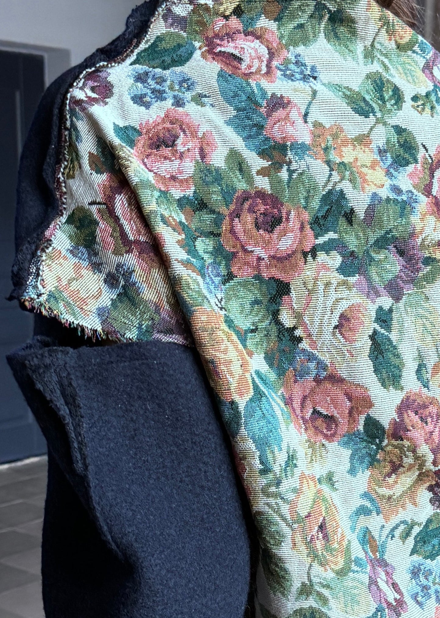 Blue wool sweater, open shoulders, with rose jacquard