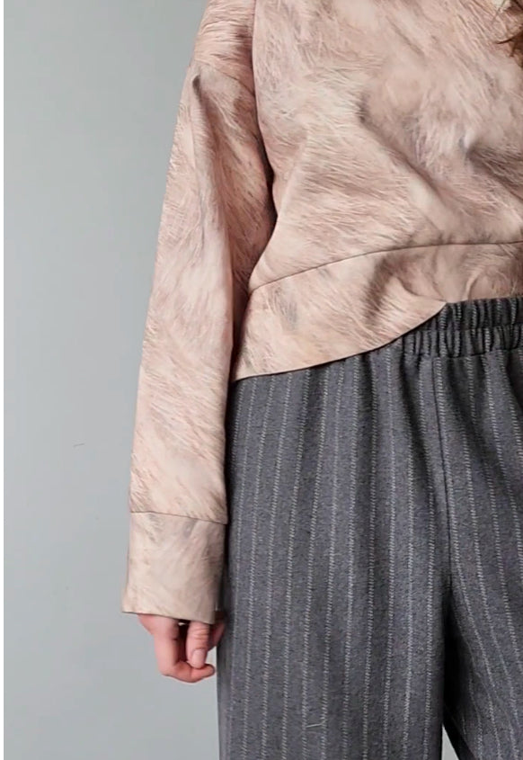 Short woolen hoodie with an abstract print