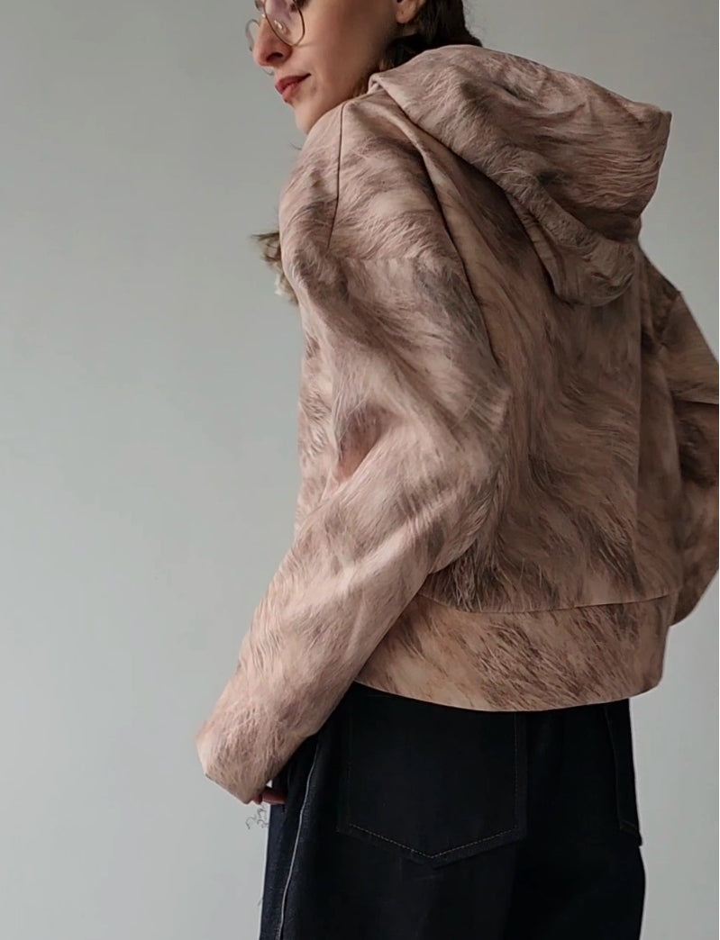 Short woolen hoodie with an abstract print