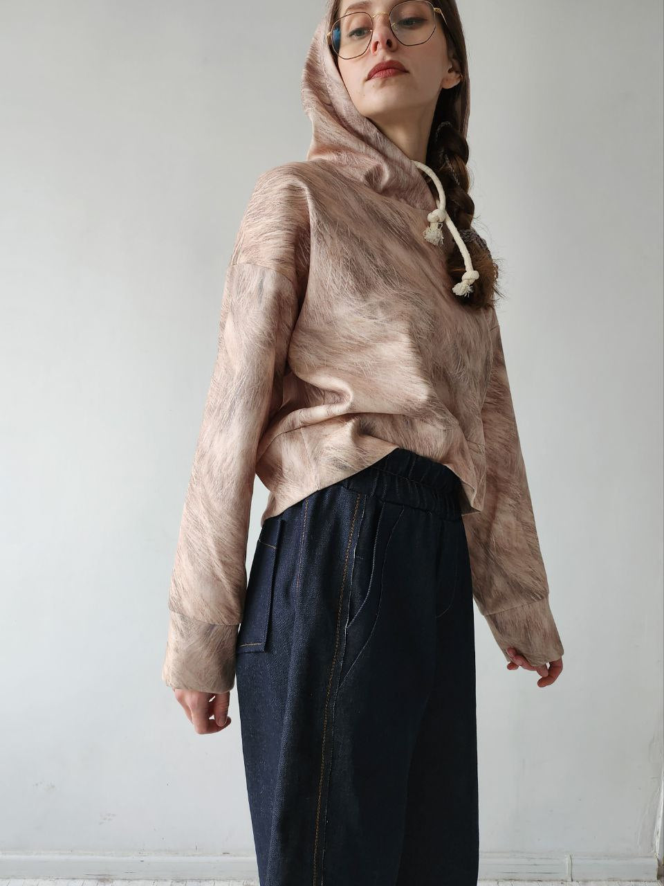 Short woolen hoodie with an abstract print