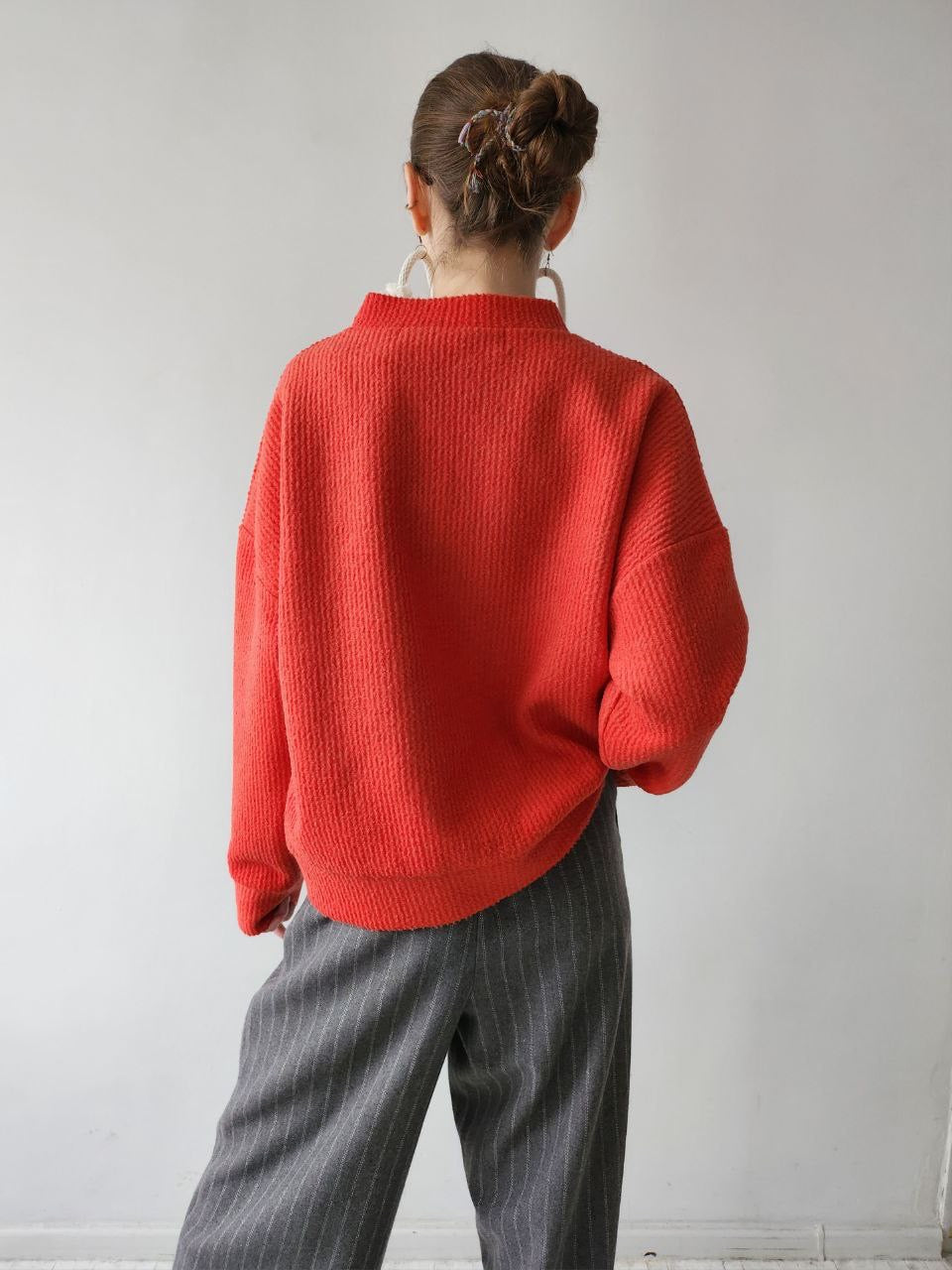 Orange-red textile trapeze sweater