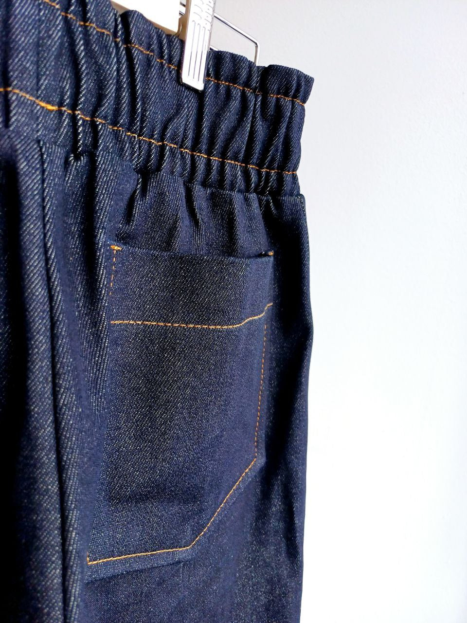 Wide, tight jeans with stripes and fringe