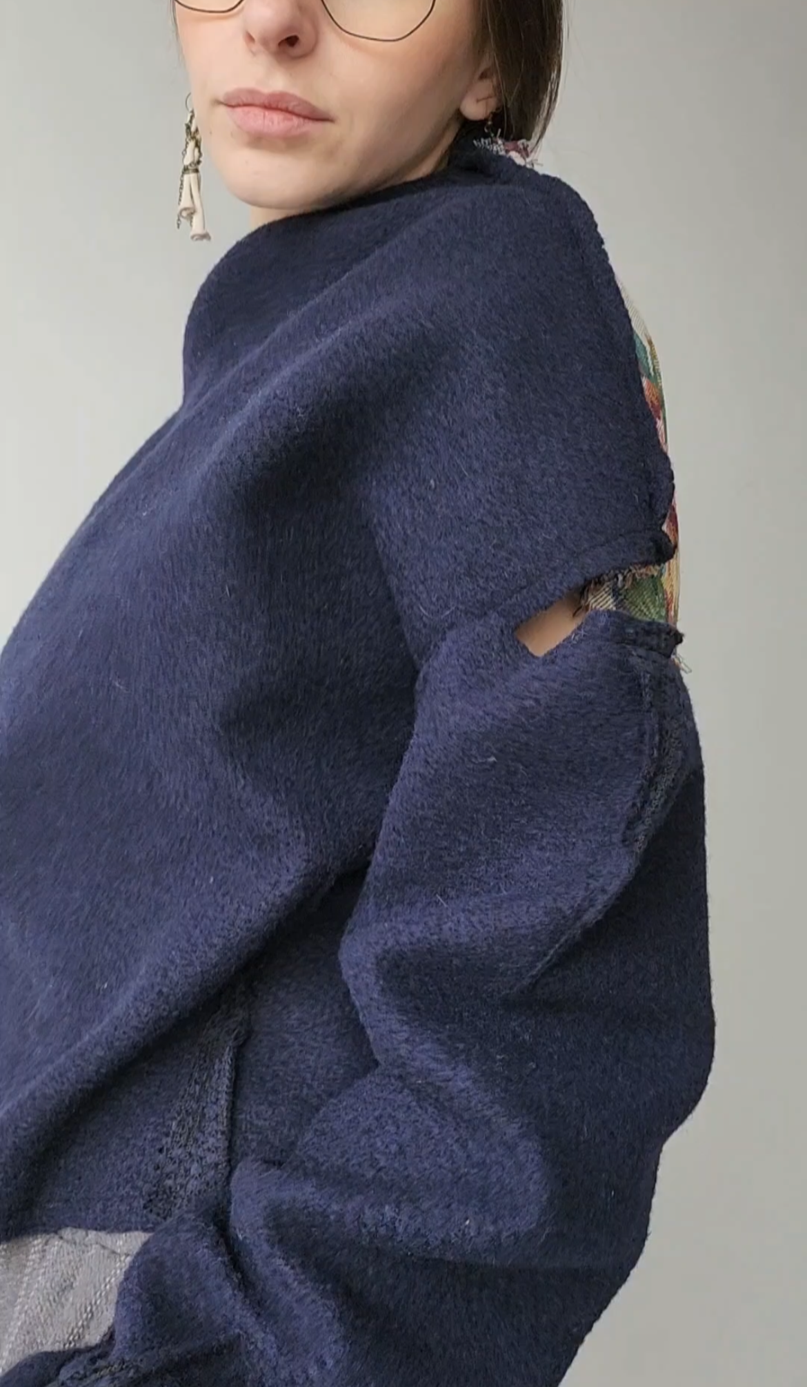 Blue wool sweater, open shoulders, with rose jacquard