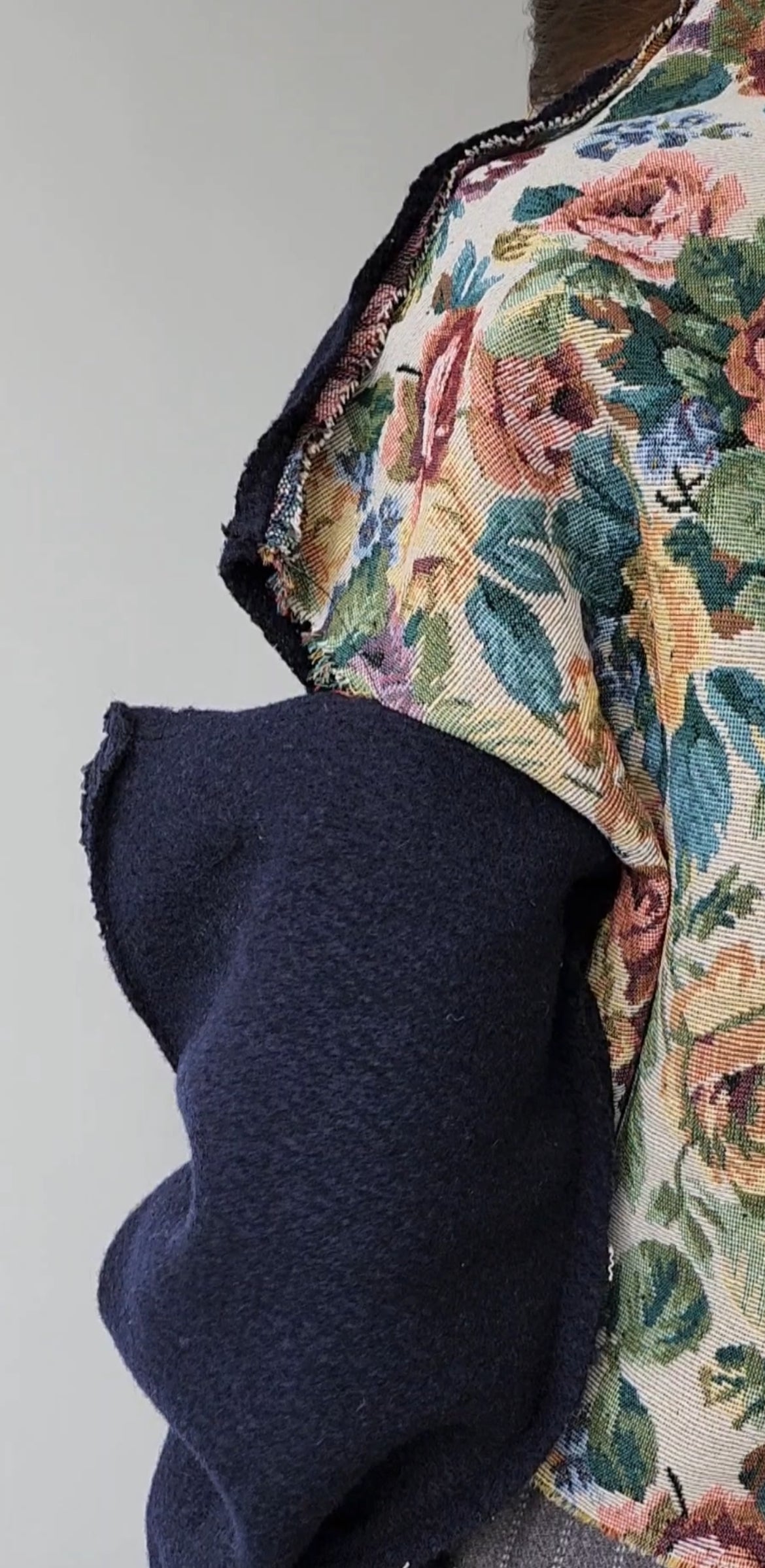 Blue wool sweater, open shoulders, with rose jacquard