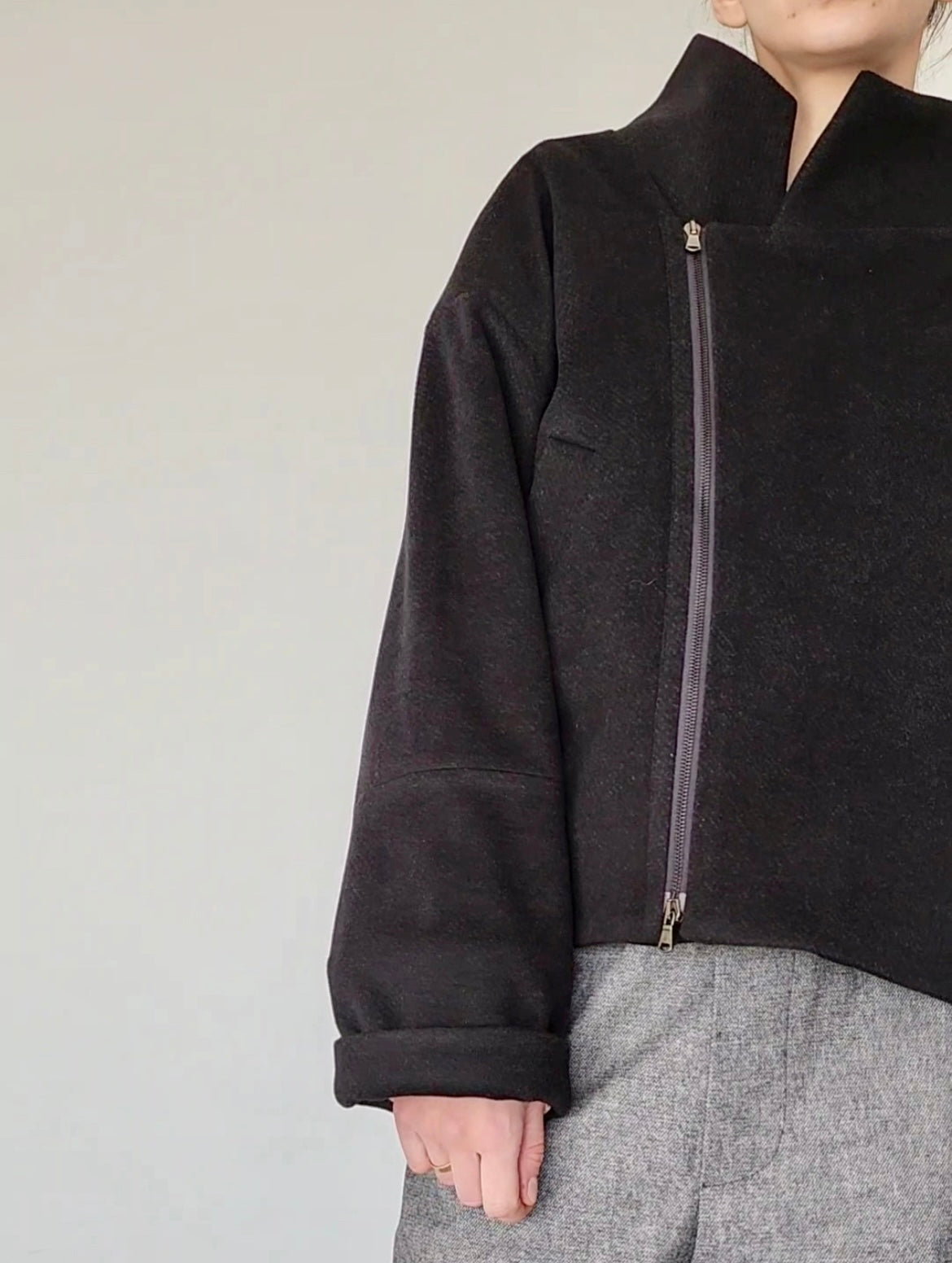 Short black wool coat with zipper