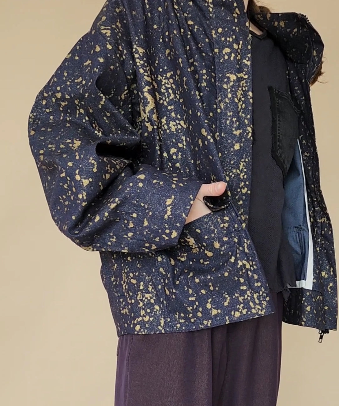 Denim bomber jacket in ink with gold detailing on the back