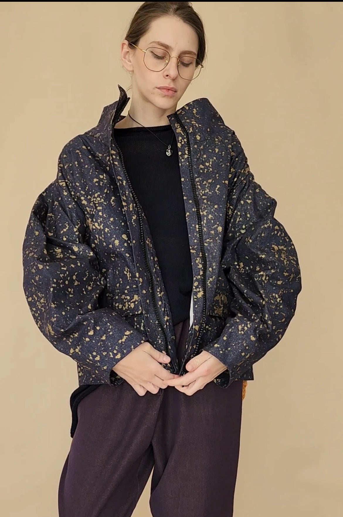 Denim bomber jacket in ink with gold detailing on the back