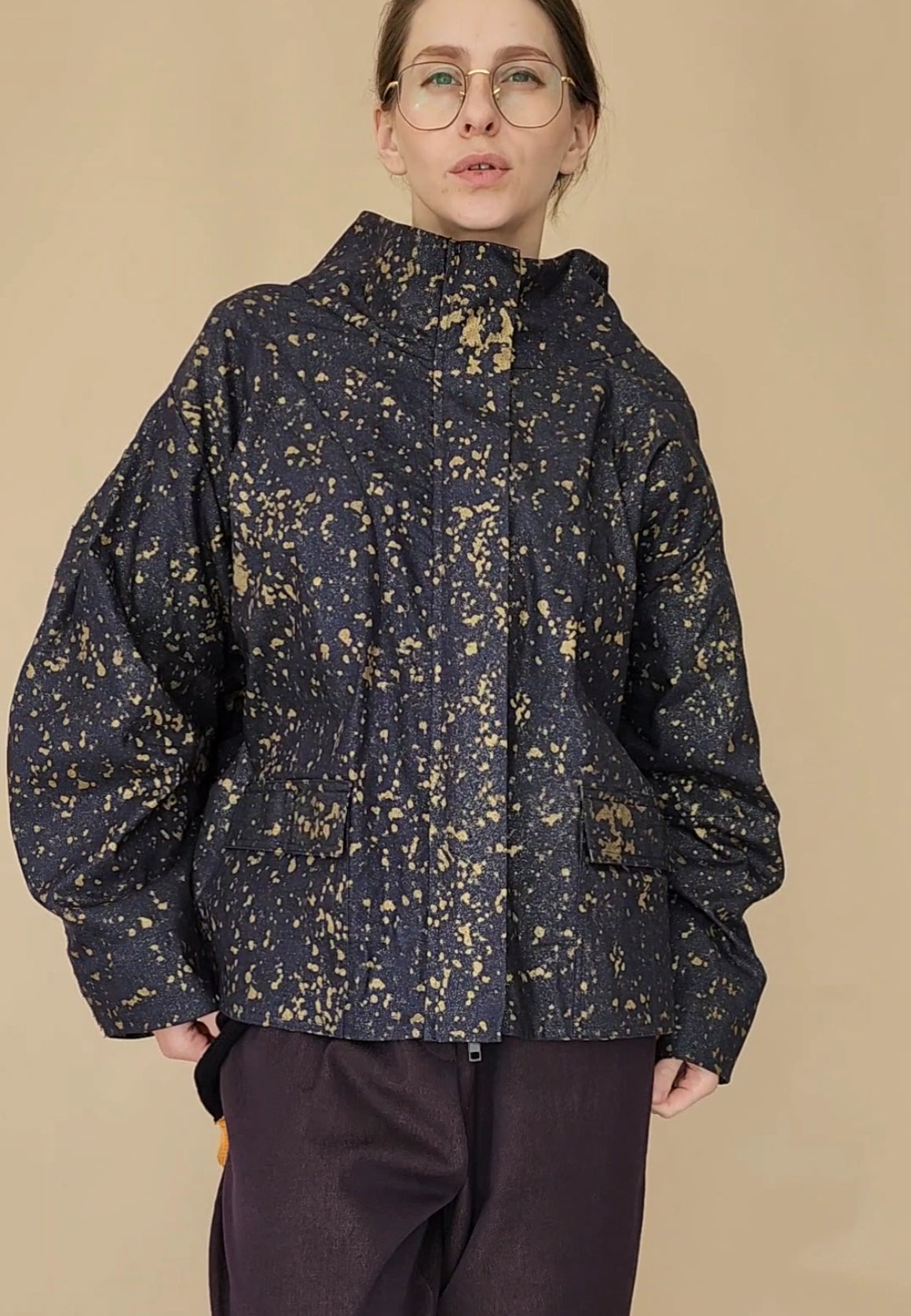 Denim bomber jacket in ink with gold detailing on the back