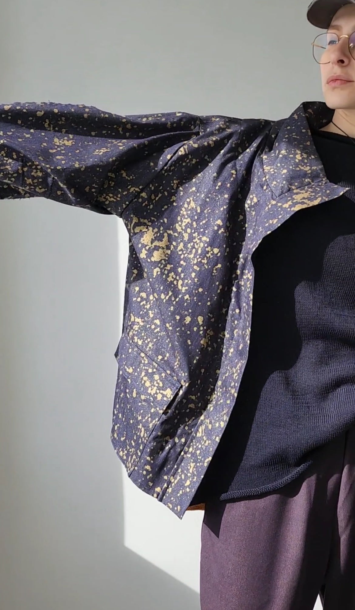 Denim bomber jacket in ink with gold detailing on the back