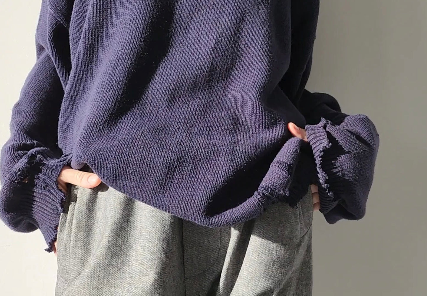 Reworked black cotton sweater with denim sleeves