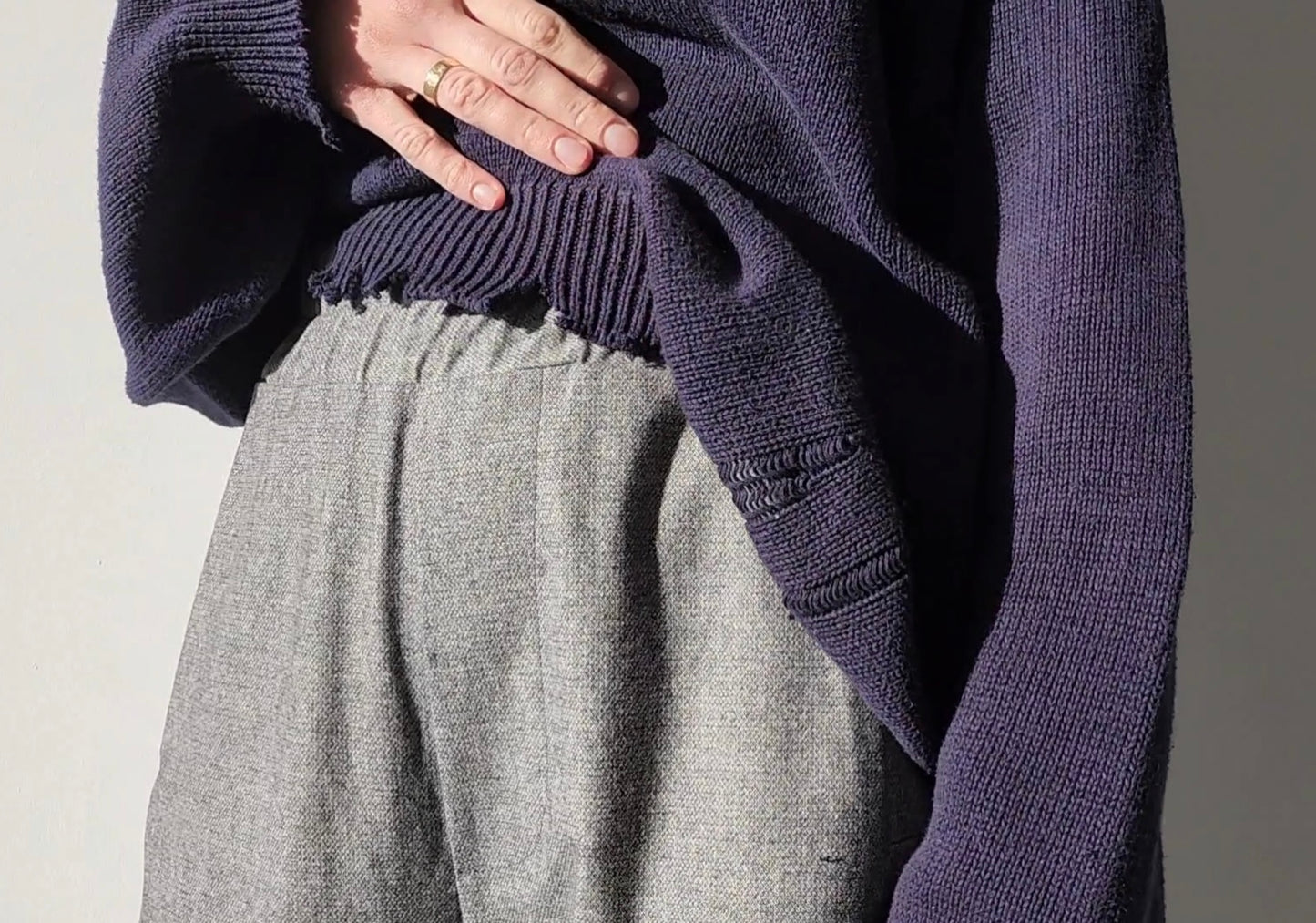 Reworked black cotton sweater with denim sleeves