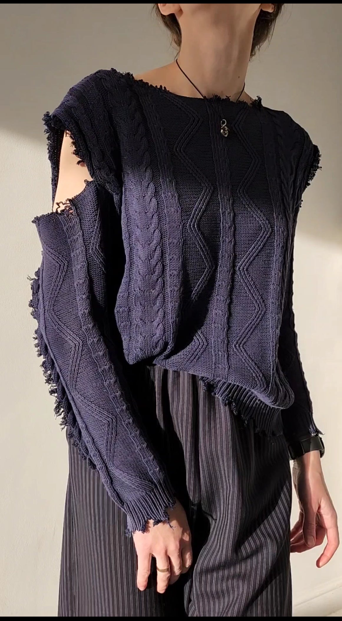 Reworked black cotton sweater with denim sleeves