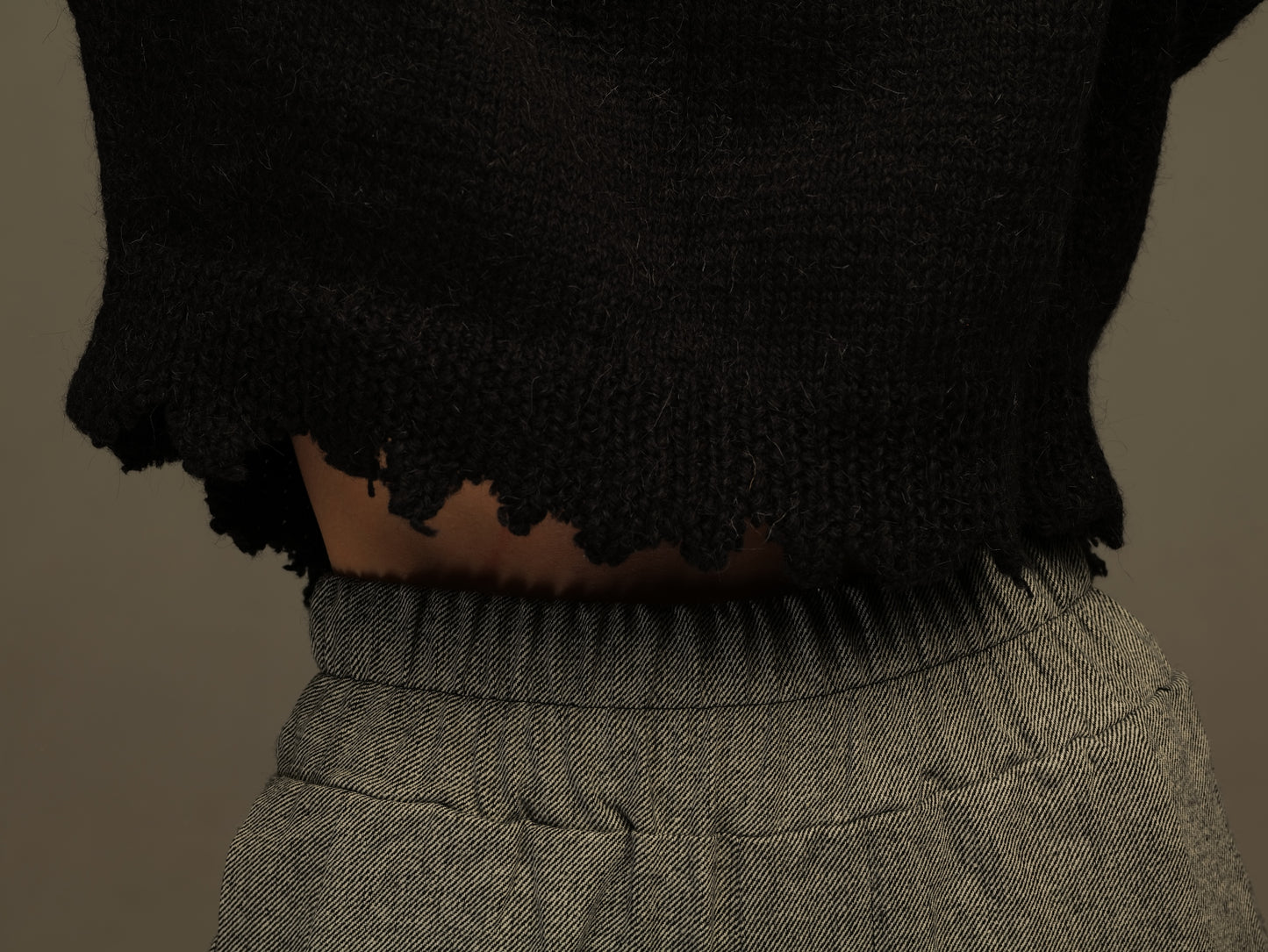 Short black woolen sweater