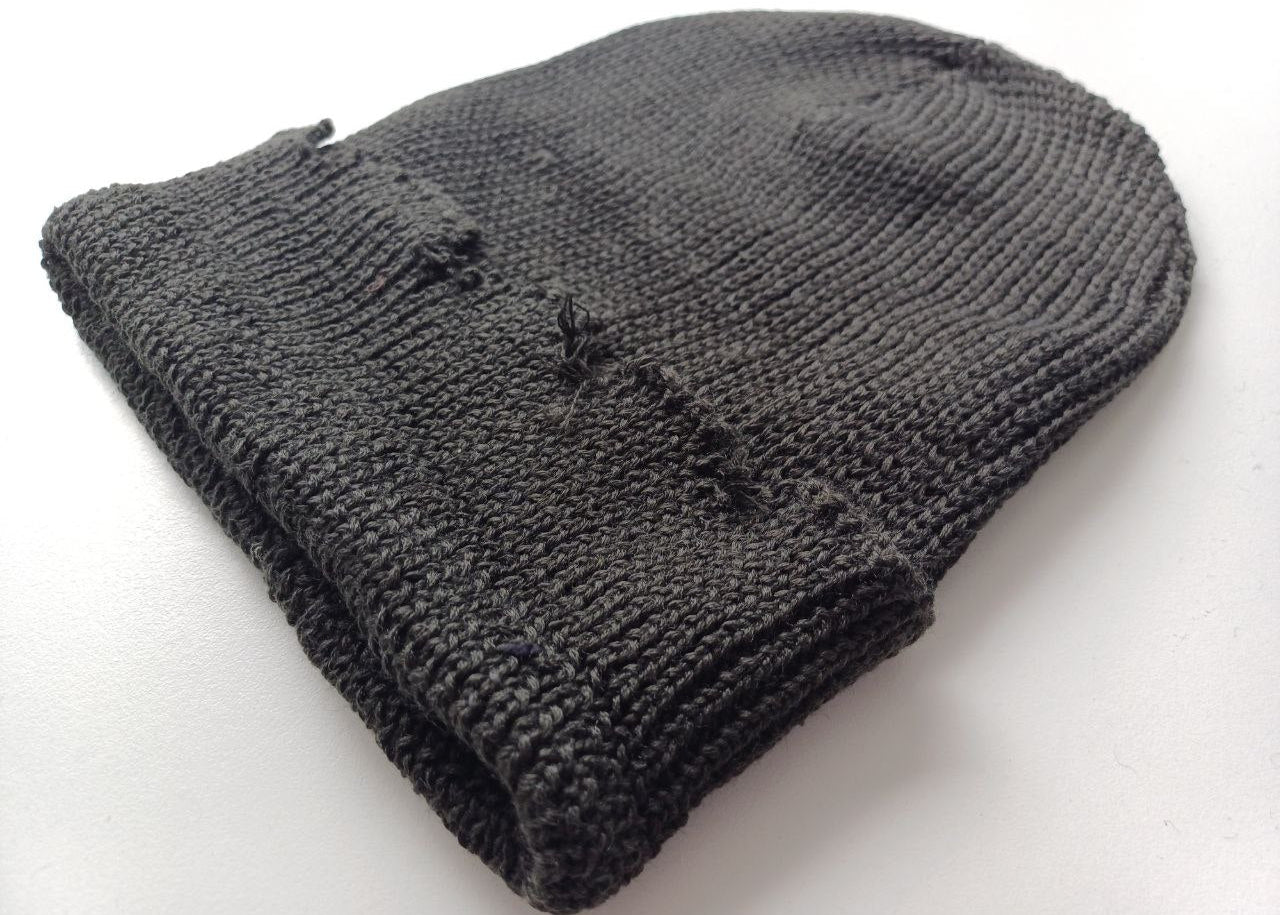 The raps cap is torn, light gray