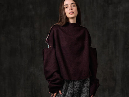 Open-shoulder burgundy wool sweater with a rose back