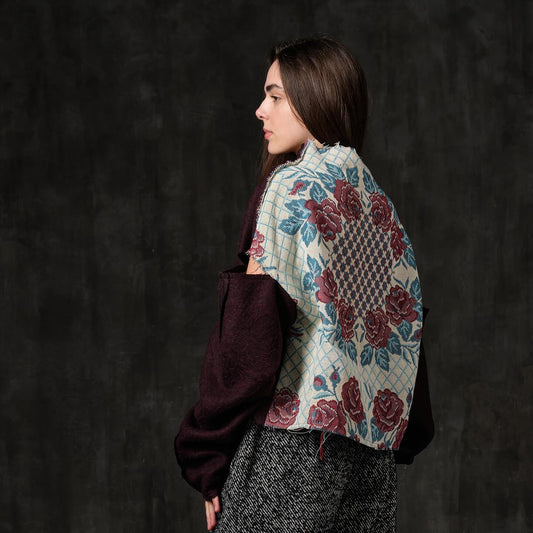 Open-shoulder burgundy wool sweater with a rose back