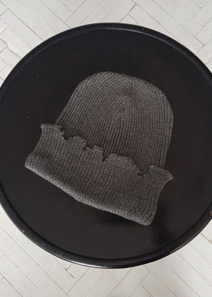 The raps cap is torn, light gray