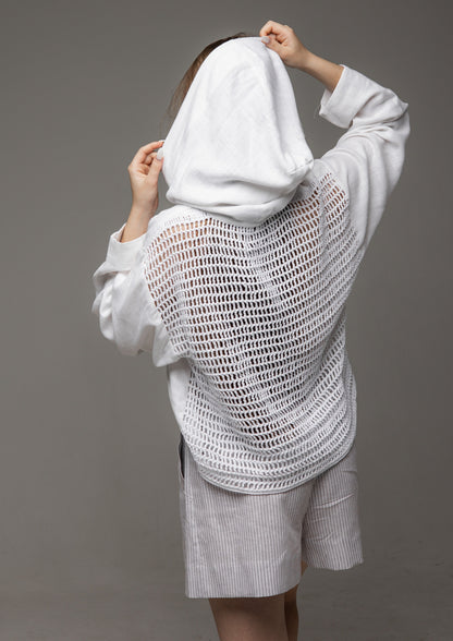 A white linen shirt with a hood and a mesh back