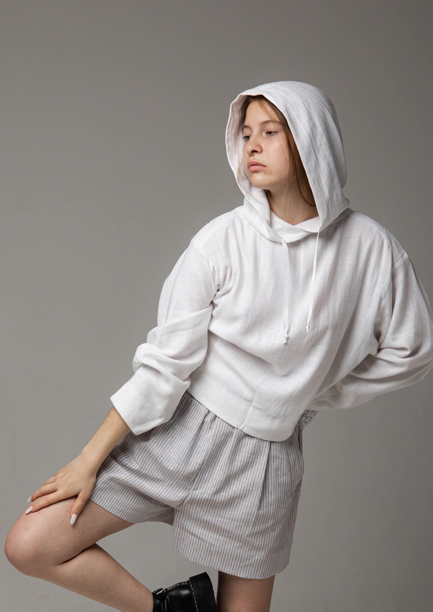 A white linen shirt with a hood and a mesh back