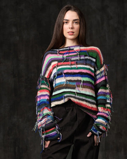 Hand-knitted sweater of rasta stripes with threads