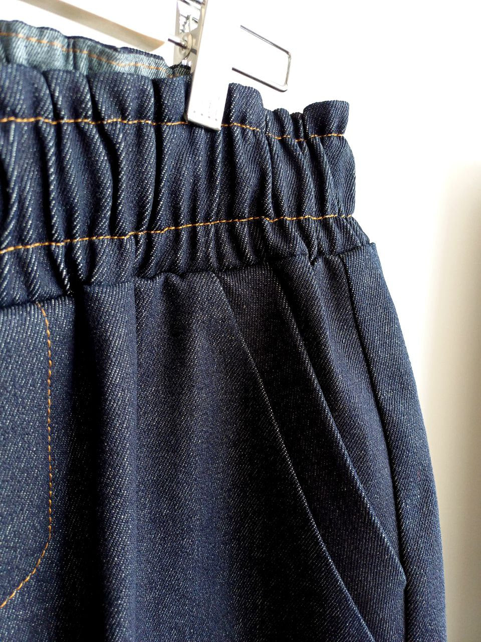 Wide, tight jeans with stripes and fringe