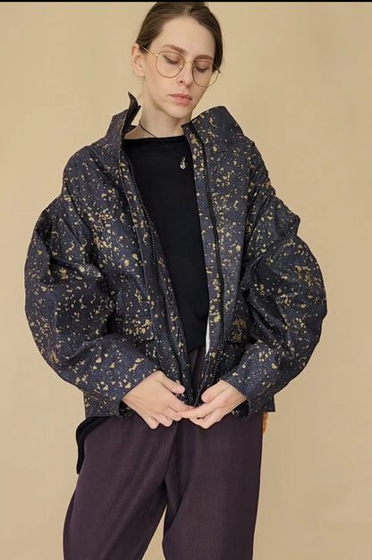 Denim bomber jacket in ink with gold detailing on the back