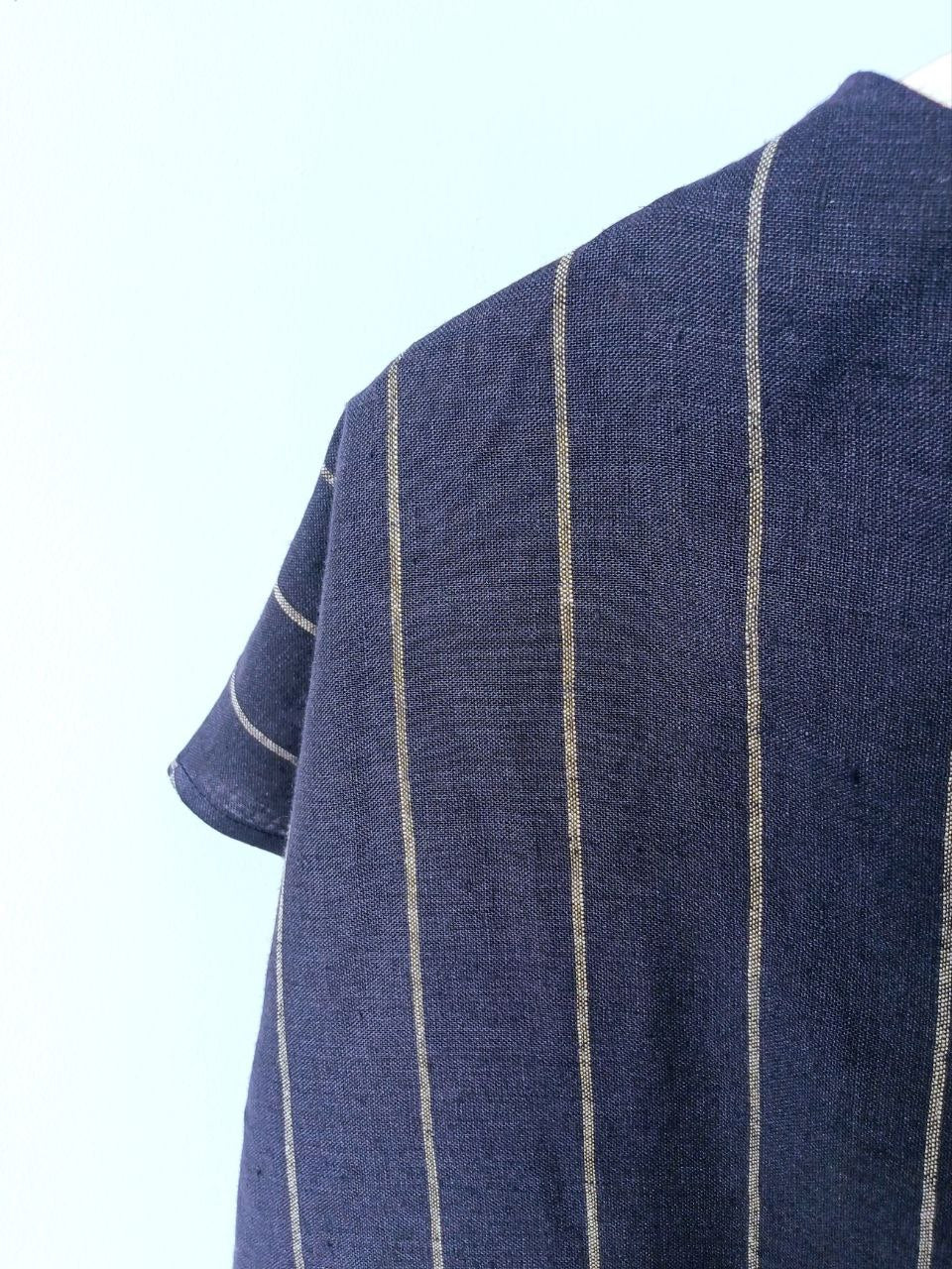 Top linen rack in a stripe