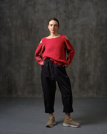 Reworked red cotton sweater with ornamented sleeves