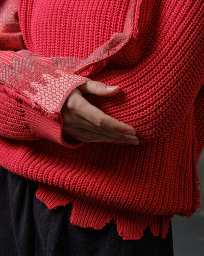 Reworked red cotton sweater with ornamented sleeves