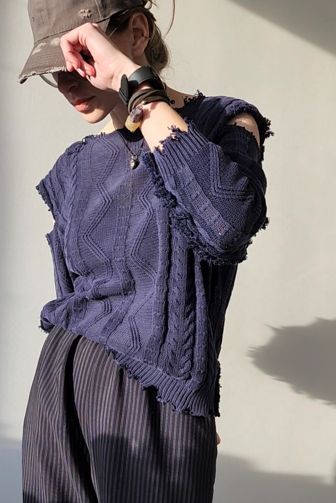 Reworked black cotton sweater with denim sleeves