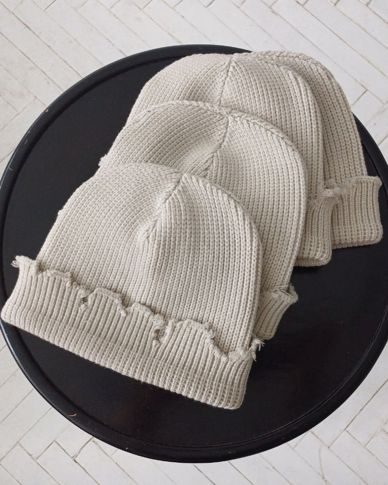 The raps cap is torn, light gray