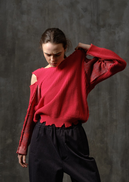 Reworked red cotton sweater with ornamented sleeves