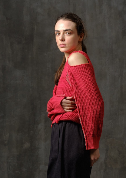 Reworked red cotton sweater with ornamented sleeves