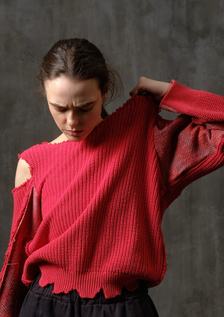 Reworked red cotton sweater with ornamented sleeves